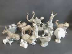 A collection of Nao animal figures including cats,