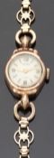 Majex 9ct gold ladies wristwatch with gold hands and markers and stylized lugs,