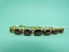 A Victorian bracelet set with emerald cut garnets