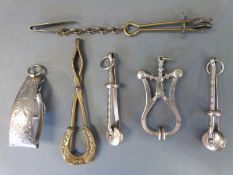 Six various skirt lifters including a horseshoe examples