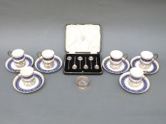 A set of six hallmarked silver-mounted Royal Worcester coffee cups and saucers,