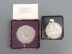 A 1935 George V 'rocking horse' crown together with a Festival of Britain 1951 example