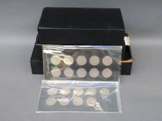 A collection of approximately 50 modern crowns, including 1951,