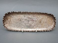 A Victorian embossed hallmarked silver pen or dressing table tray, import marks for London 1890,