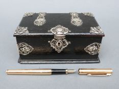 A white metal mounted wooden box,