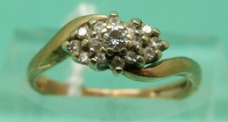 A 9ct gold ring set with diamonds in a cluster (size J), weight 2.