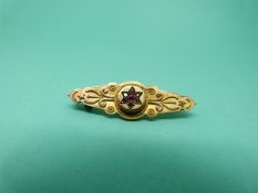 A 9ct gold brooch set with paste and a hair compartment verso