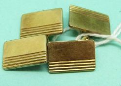 A pair of yellow metal cufflinks, 4.