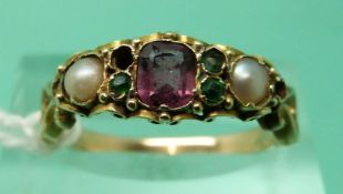 An early Victorian ring set with a garnet,