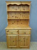 A pine dresser with plate rack above (W96 x D45 x H184cm)