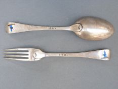 A Dutch white metal fork and spoon with enamel, possibly shipping interest flags,