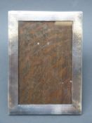 A George V hallmarked silver photograph frame to suit 6x4 inch photo, with engine turned decoration,