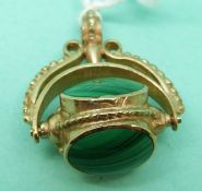 A 9ct gold swivel fob set with three malachite cabochons