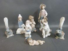 A collection of boxed Lladro dog,