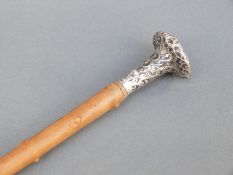 Local interest white metal topped swagger or walking stick, marked to top E.L.