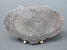 An unusual continental white metal compact, opening to reveal powder and space for lipstick,