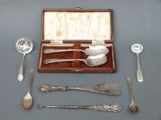 Three pieces of hallmarked silver cutlery including a Georgian mustard spoon and a sifter spoon,