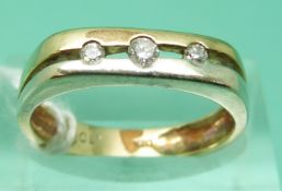 A 9ct gold bi-coloured ring set with three diamonds (size L), weight 2.