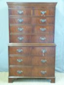 A reproduction mahogany chest on chest comprising two over six graduated drawers (W97 x D50 x
