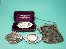 A silver mesh purse and three hallmarked silver Victorian brooches
