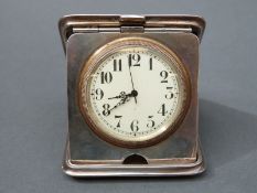 A George V hallmarked silver travelling clock with Swiss movement, Chester 1913 maker's mark rubbed,