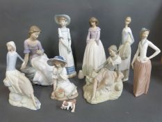 A collection of Nao figurines in various poses