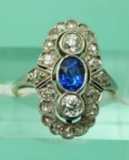 An 18ct gold ring set with an oval mixed cut sapphire measuring approx 0.