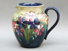 A Moorcroft jug in Spring Flowers pattern, signed to base,
