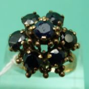 A 9ct gold ring set with sapphires in a cluster (size M)