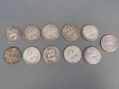 Eleven George III crowns, mainly worn,