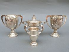 Four various hallmarked silver trophy cups including two of the same design,