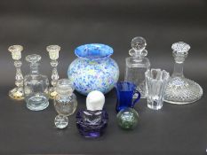 A collection of clear and coloured glassware including a pair of enamelled candlesticks,