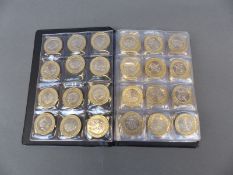 Schulz coin collector's album containing 90 collectable £2 coins