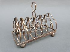 A George III hallmarked silver six-slice toast rack,