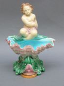 Minton majolica putti on clam,