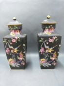 A pair of English porcelain famille noir covered vases, 33cm tall.