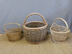 A large wicker log basket and two others