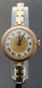 Swiss 9ct gold wristwatch with black Roman numerals,