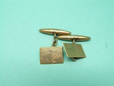 A pair of 9ct gold engine turned cufflinks, 3.