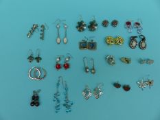 A collection of 20 pairs of silver earrings including pearl, glass,