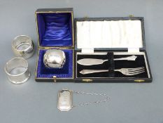 Three various hallmarked silver napkin rings including a cased example,