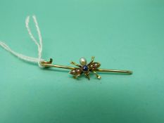 A 15ct gold insect set with a sapphire and seed pearls