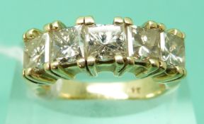 A 14ct gold ring set with five princess cut diamonds each approximately 0.