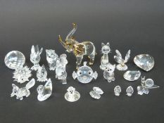 Twenty-one Swarovski cut glass animals and paperweights including fish, elephant, birds, swans, fox,