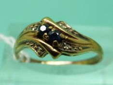 A 9ct gold ring set with two sapphires and diamonds (size L)