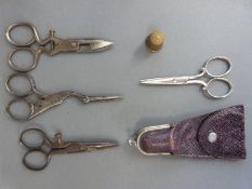 Three sets of sewing scissors including a pair formed as a stork and a sewing set in pouch