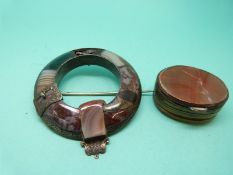 A silver Scottish brooch in the form of a buckle set with agate sections and an agate box