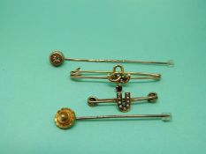 Two Victorian stick pins one set with a diamond,