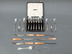 A cased set of George VI hallmarked silver cake forks,