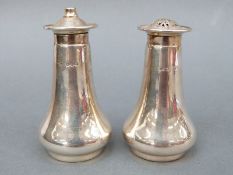A George VI hallmarked silver salt and pepper, Sheffield 1947, maker Atkin Brothers, height 8.